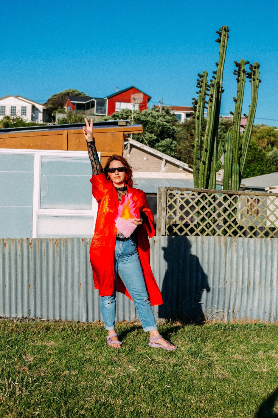 Ash — peace sign, hand-tufted heart, kowhai-yellow Aotearoa sun